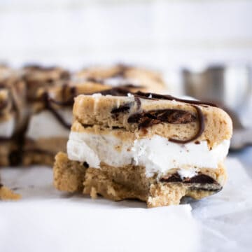 creamy vanilla icecream between two layers of smooth cookie dough with chocolate chunks