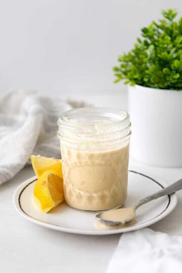 lemon tahini dressing in a jar.