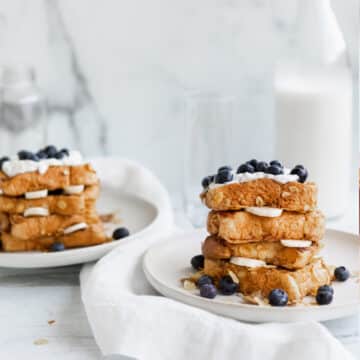 Vegan cornflake french toast, brioche bread with blueberries and a drizzle of agave syrup.