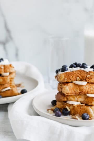 Vegan cornflake french toast, brioche bread with blueberries and a drizzle of agave syrup.