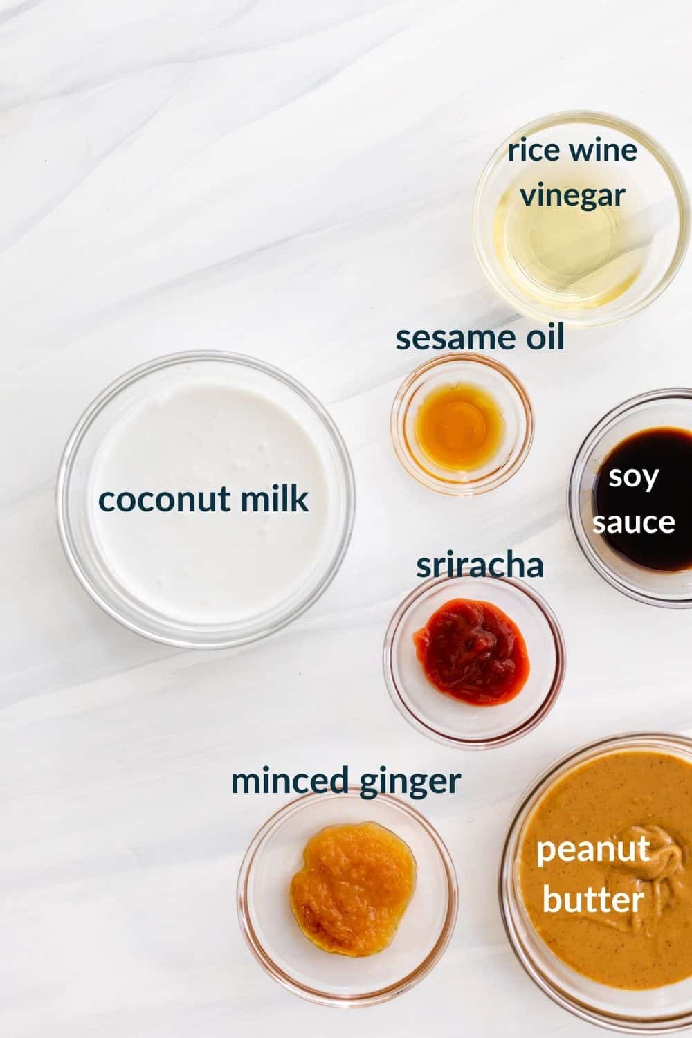 ingredients in bowls - coconut milk, minced ginger, peanut butter, sriracha, soy sauce, rice wine vinegar and sesame oil