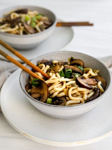 Mushroom Noodle Bowl with scallions and chopsticks