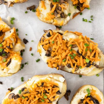 Vegan twice baked potatoes with cheese, mushrooms, and scallions.