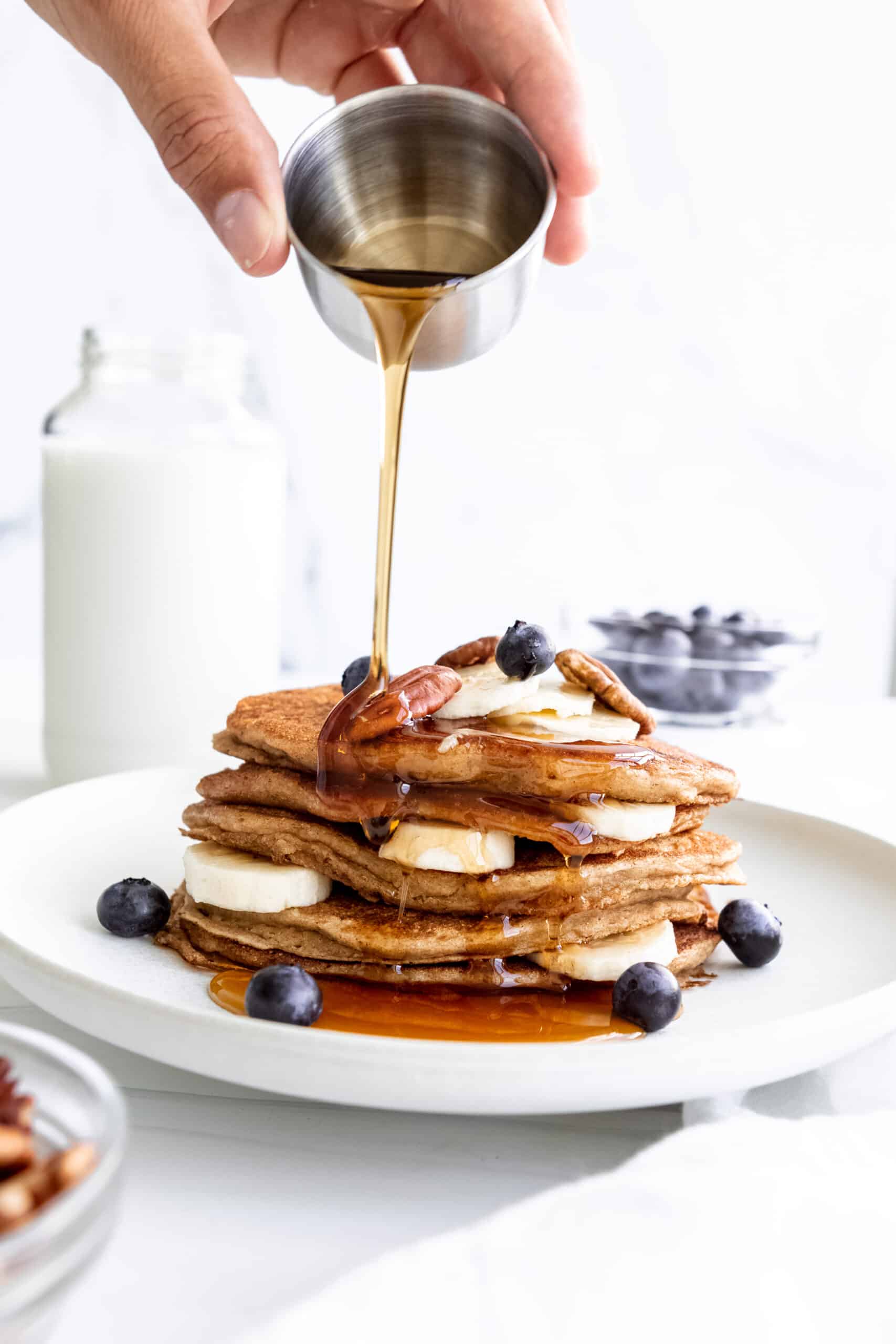 pancakes made with vegan ingredients, blueberries and banana slices.