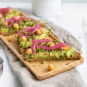 avocado toast with chickpeas, sprouts and pickled red onion