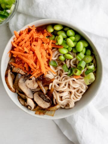 easy vegan ramen noodles with carrots, edamame, mushrooms, onions, and miso broth