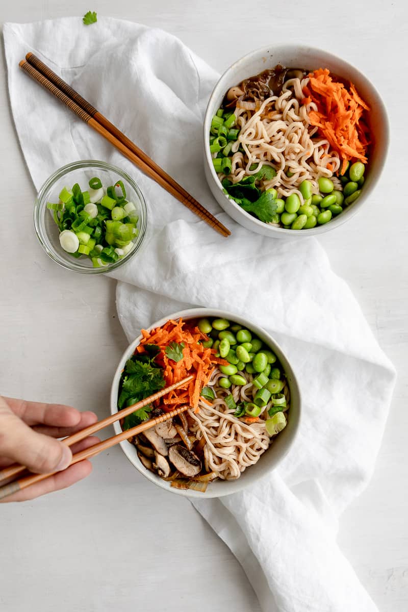 chopsticks reaching in for a bite of easy vegan ramen noodles