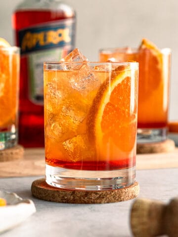 aperol cocktail with fresh orange slice and ice