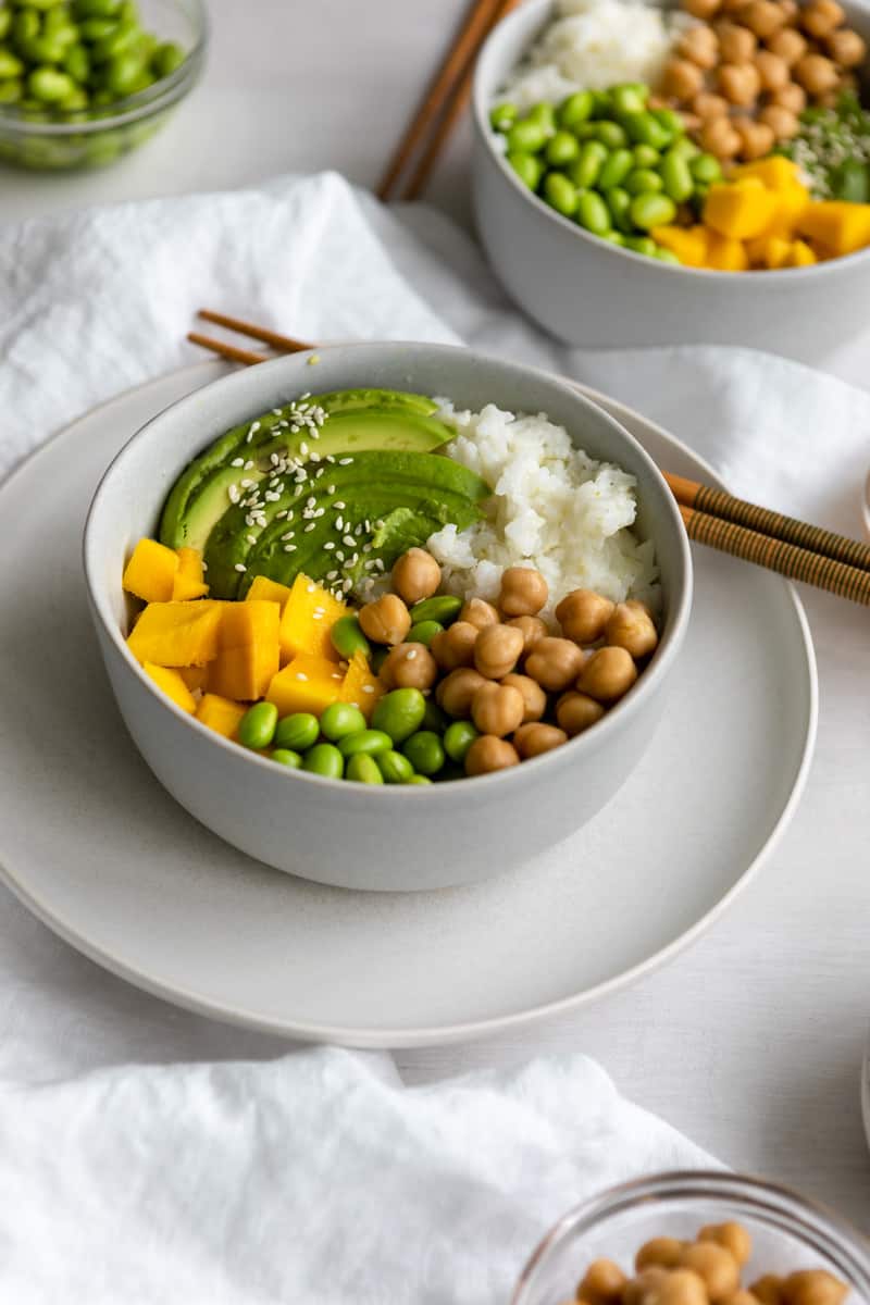 buddha bowl with avocado, mango, coconut rice, chickpeas and edamame