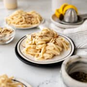 noodles with white bean pasta sauce with pepper flakes and toasted almonds
