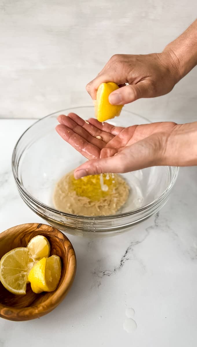 Lemon squeezing into a bowl