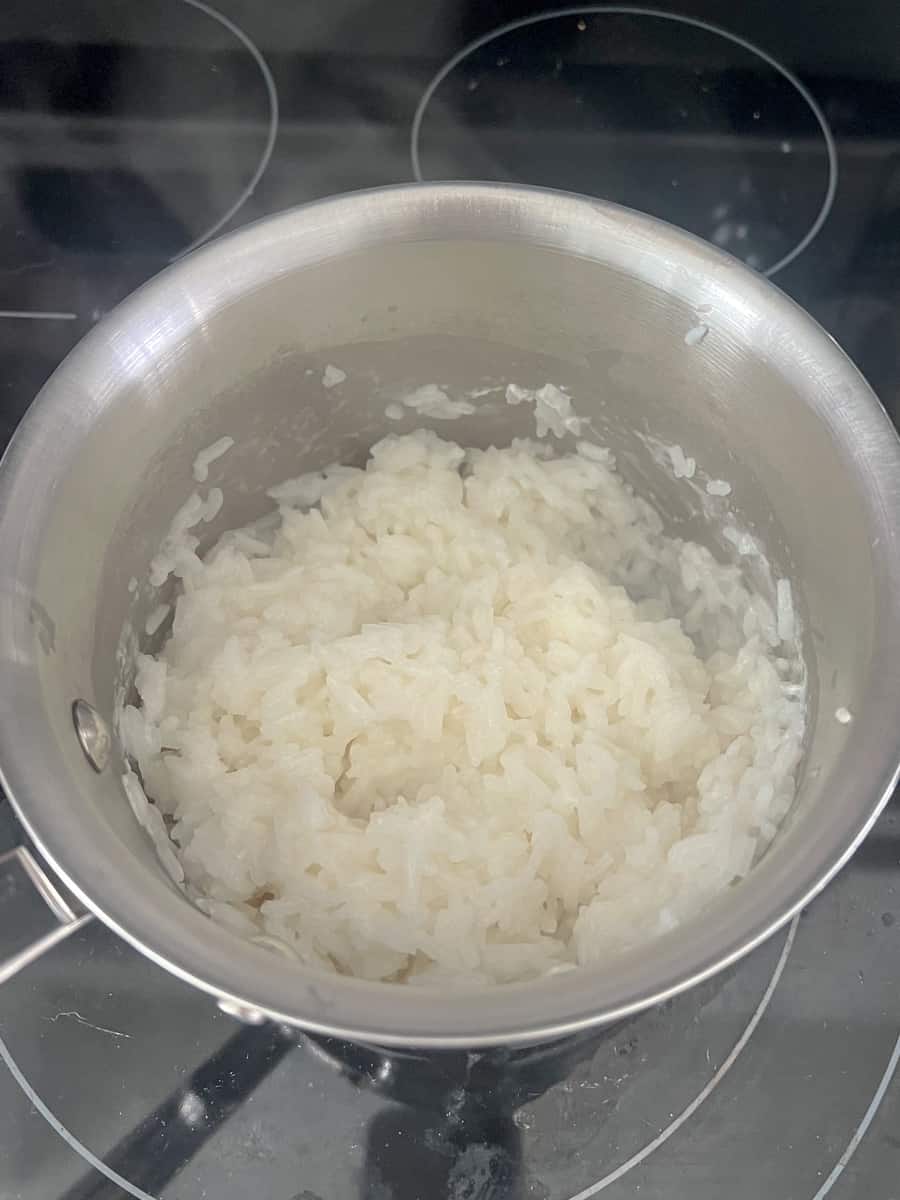Coconut rice is still a little thick and gluey - needs to cook for a few more minutes.