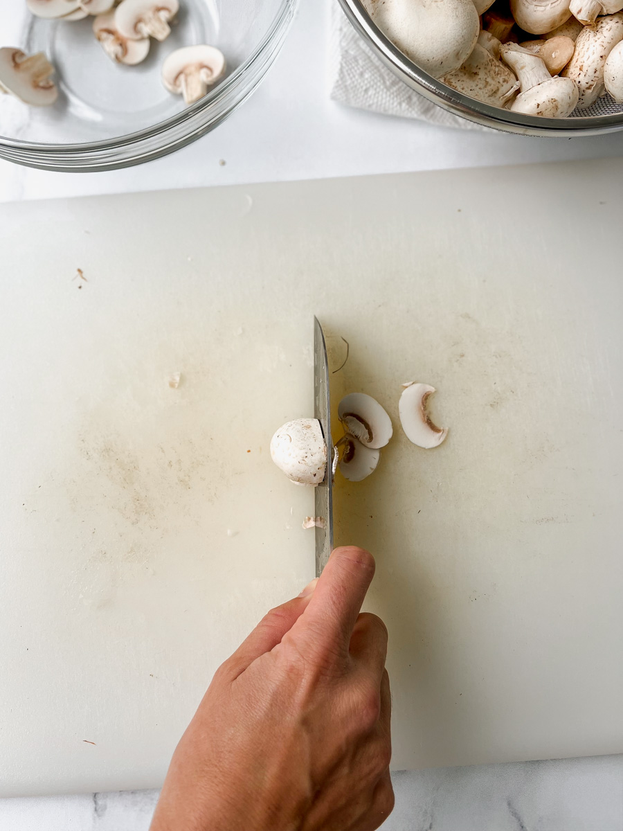 thinly slicing a mushroom
