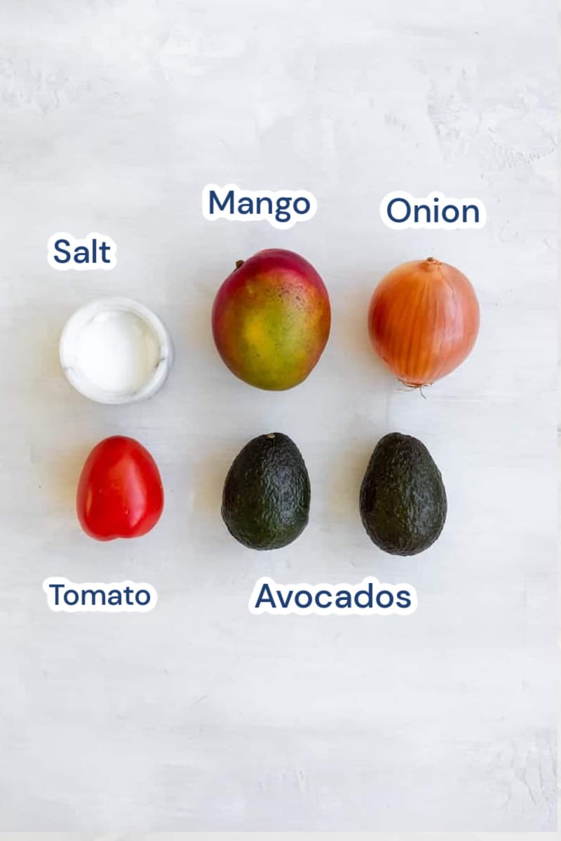 ingredients for mango guacamole: mango, onion. salt, avocados,  tomato.