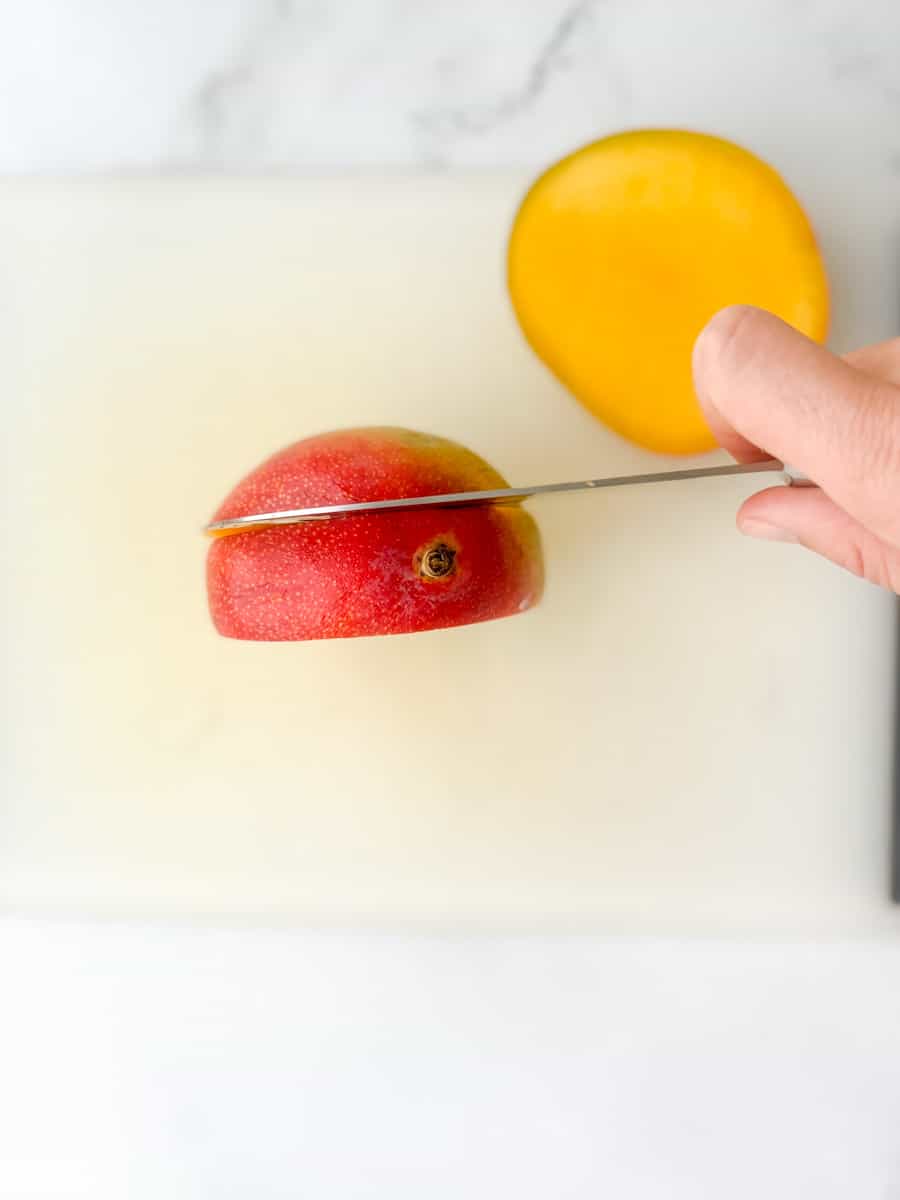 slicing off the other third of a mango