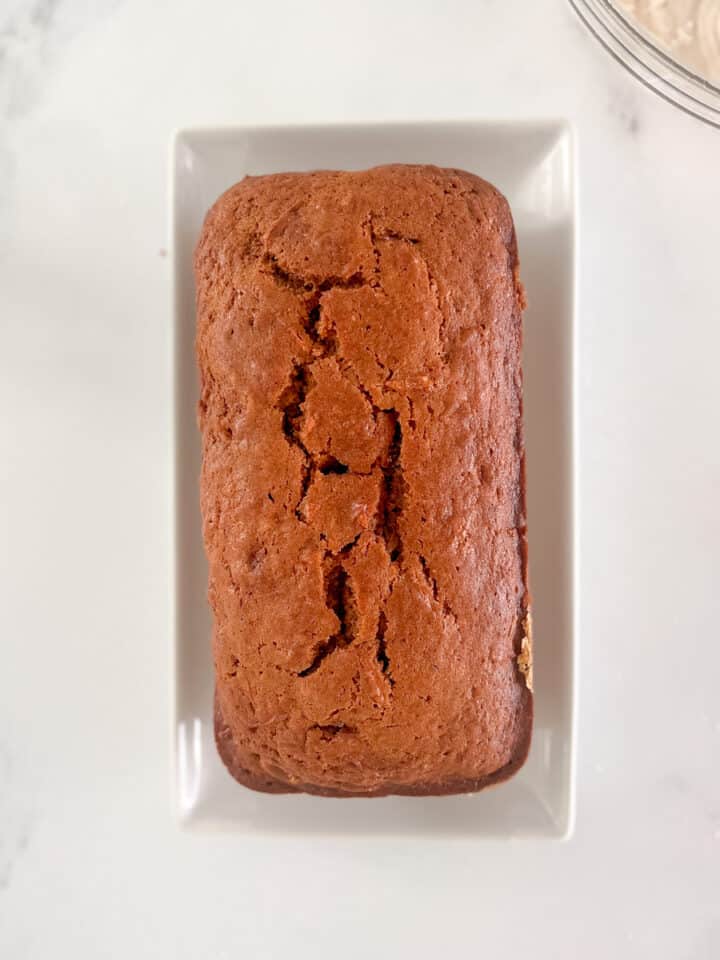 baked carrot cake bread on a plate