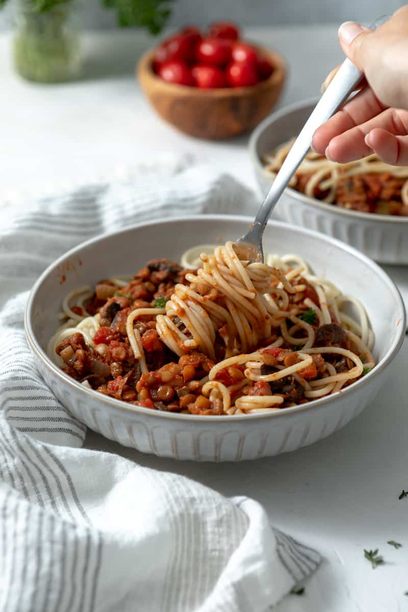 fork twirling lentil spaghetti bolognese