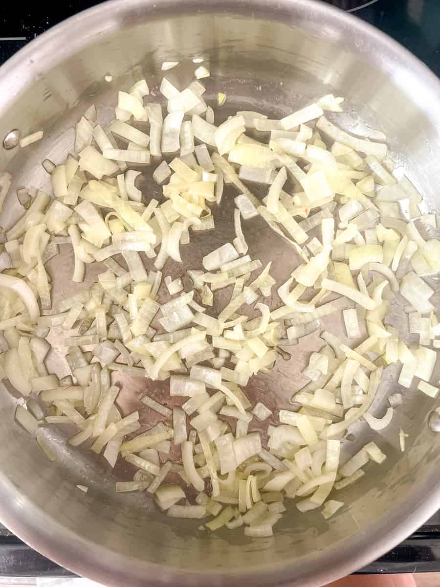 slightly translucent diced onion in a saute pan
