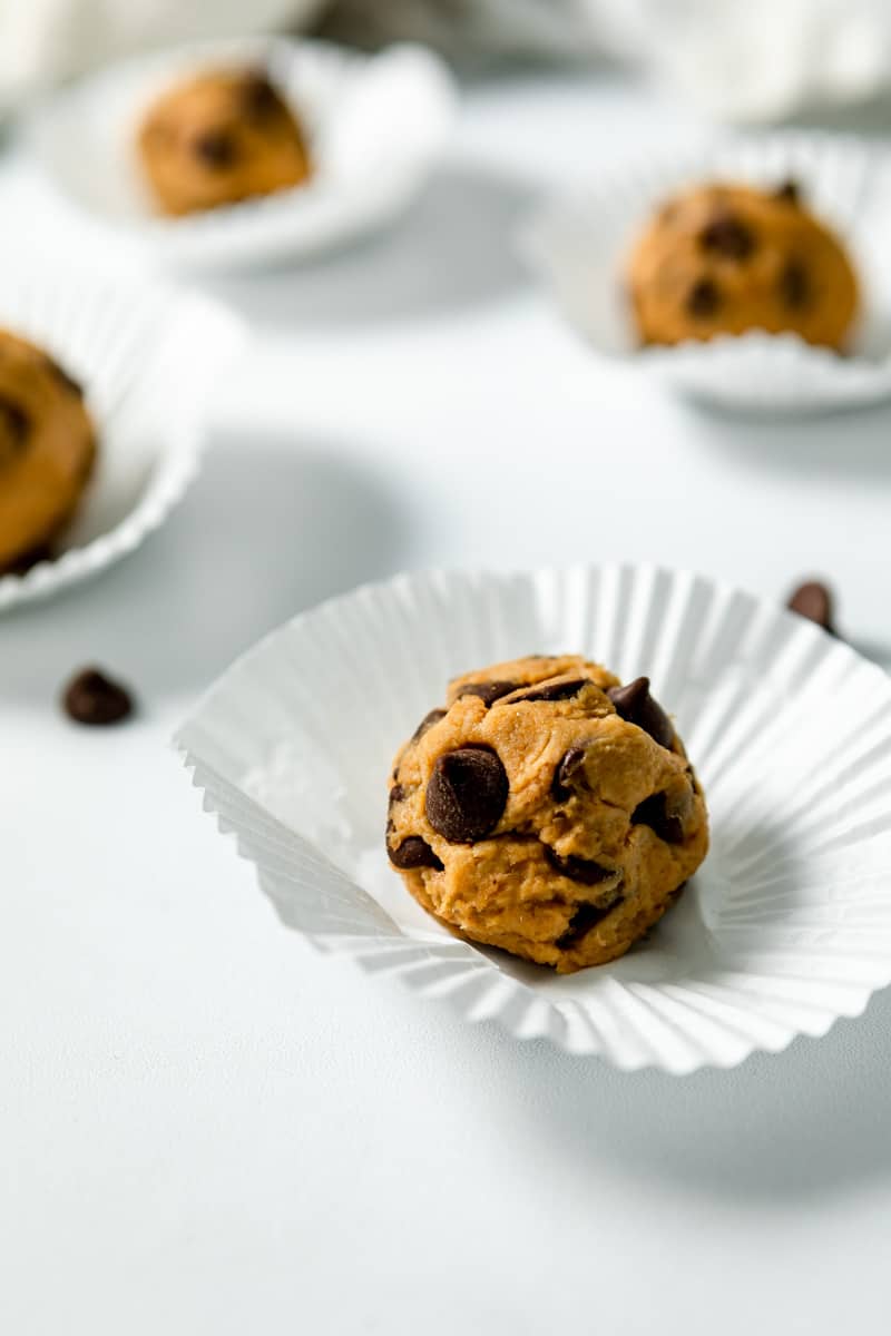 cookie dough protein ball on a cupcake wrapper