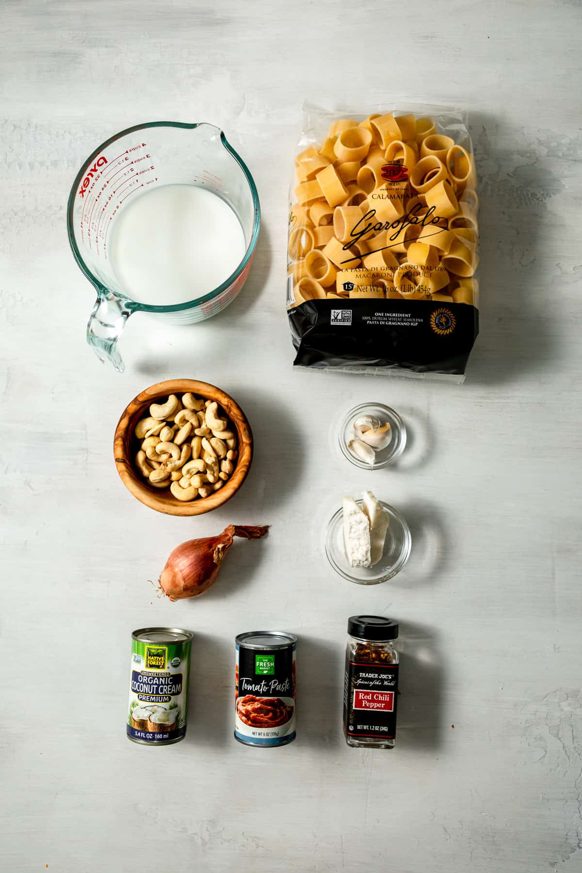 ingredients laid out in two rows in bowls or original packaging. 